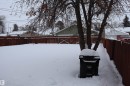 Yard layered in snow featuring a fenced backyard - 5109 55 Street, Barrhead, AB  - Outdoor 