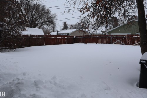 View of fenced backyard - 5109 55 Street, Barrhead, AB - Outdoor