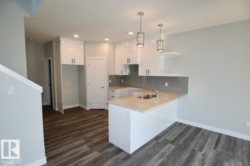 4918 47 Street, Gibbons, AB - Indoor Photo Showing Kitchen With Double Sink