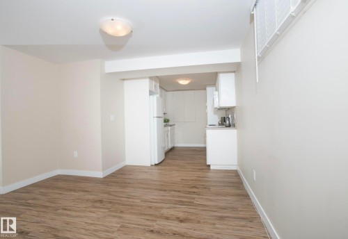 Interior space with light wood-style floors and baseboards - 13616 82 Street Nw, Edmonton, AB - Indoor