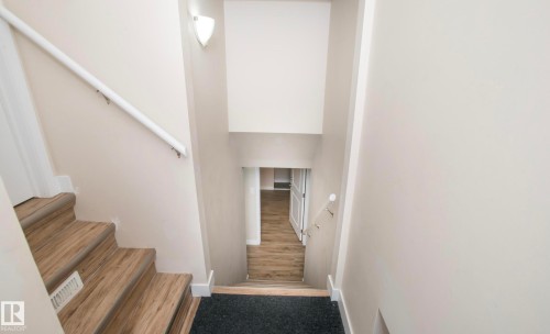 Staircase with baseboards - 13616 82 Street Nw, Edmonton, AB - Indoor Photo Showing Other Room