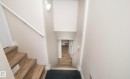 Staircase with baseboards - 13616 82 Street Nw, Edmonton, AB  - Indoor Photo Showing Other Room 