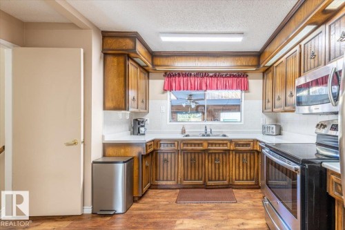 23 Allen Place, Leduc, AB - Indoor Photo Showing Kitchen With Double Sink