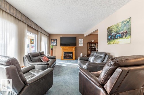 23 Allen Place, Leduc, AB - Indoor Photo Showing Living Room With Fireplace