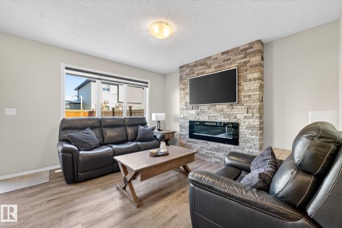 9040 Cooper Link, Edmonton, AB - Indoor Photo Showing Living Room With Fireplace