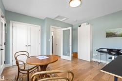 Dining space with light wood finished floors - 