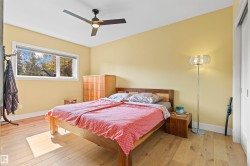 Bedroom featuring light wood-type flooring, a ceiling fan, and a closet - 
