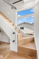 Stairs with hardwood / wood-style floors - 