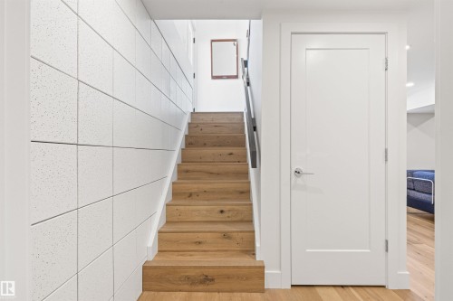 Staircase with wood finished floors - 14412 80 Avenue Nw, Edmonton, AB - Indoor Photo Showing Other Room