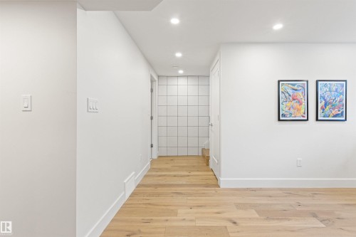Hall with light wood-style floors and recessed lighting - 14412 80 Avenue Nw, Edmonton, AB - Indoor Photo Showing Other Room