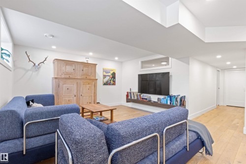 Living area featuring light wood finished floors and recessed lighting - 14412 80 Avenue Nw, Edmonton, AB - Indoor