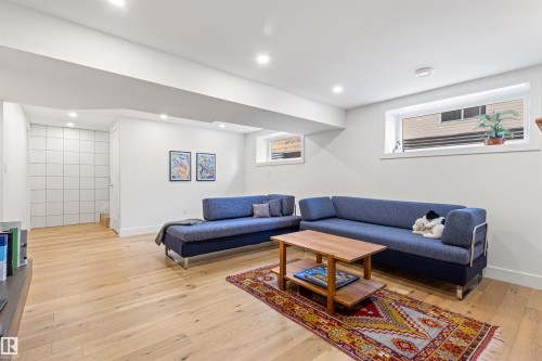 Living area featuring light wood-style floors and recessed lighting - 14412 80 Avenue Nw, Edmonton, AB - Indoor