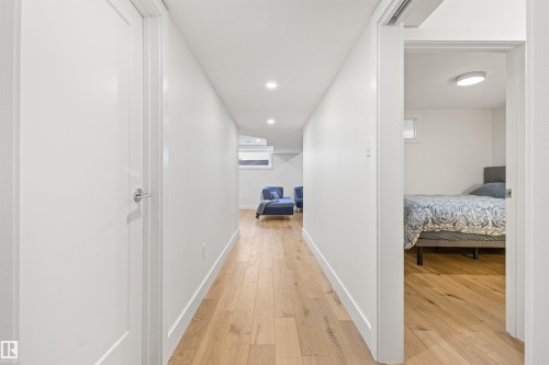 Corridor featuring light wood-style flooring and recessed lighting - 14412 80 Avenue Nw, Edmonton, AB - Indoor Photo Showing Other Room