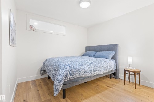 Bedroom featuring light wood finished floors and baseboards - 14412 80 Avenue Nw, Edmonton, AB - Indoor Photo Showing Bedroom