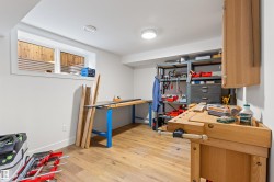 Home office with light wood-style flooring and baseboards - 