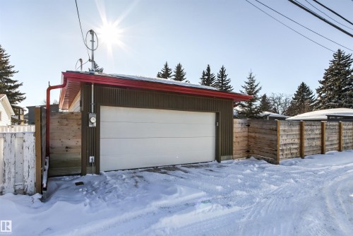 Snow covered garage with a detached garage - 14412 80 Avenue Nw, Edmonton, AB - Outdoor With Exterior