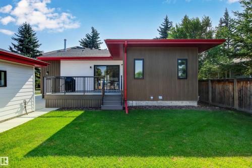 Rear view of property featuring a wooden deck and a lawn - 14412 80 Avenue Nw, Edmonton, AB - Outdoor With Deck Patio Veranda