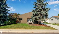 View of front of property featuring a front yard and a porch - 
