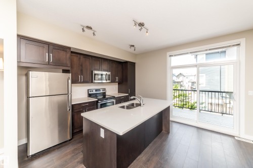 22 2560 Pegasus Boulevard, Edmonton, AB - Indoor Photo Showing Kitchen With Stainless Steel Kitchen With Double Sink