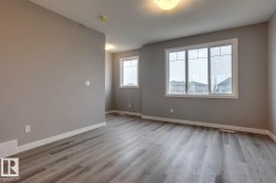 Empty room with light wood-type flooring - 