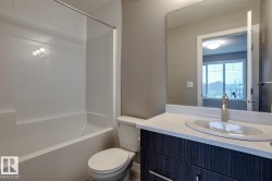 Full bathroom with vanity, shower / bath combination, and a mountain view - 