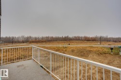 Balcony featuring a view of countryside - 