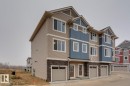 Craftsman house featuring stone siding, a garage, and driveway - 78 13139 205 Street Nw, Edmonton, AB  - Outdoor With Facade 