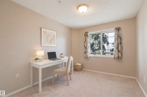 Office featuring light carpet and a textured ceiling - 209 17150 94A Avenue, Edmonton, AB - Indoor Photo Showing Office