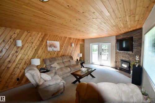223 11502 Twp Rd 604, Rural St. Paul County, AB - Indoor Photo Showing Living Room With Fireplace