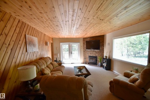 223 11502 Twp Rd 604, Rural St. Paul County, AB - Indoor Photo Showing Living Room With Fireplace