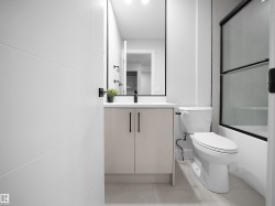 Bathroom featuring vanity, combined bath / shower with glass door, and light tile patterned flooring - 