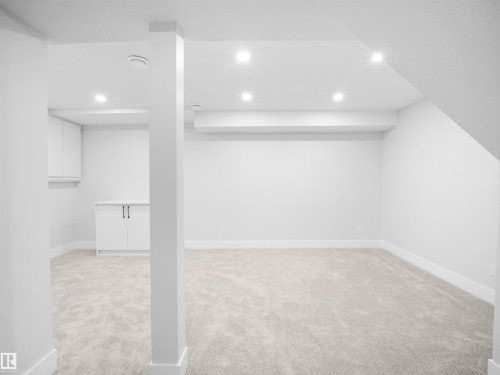 Finished basement with light colored carpet and recessed lighting - 9409 173 Street, Edmonton, AB - Indoor Photo Showing Other Room