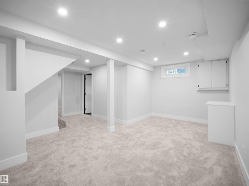 Basement with light colored carpet and recessed lighting - 9409 173 Street, Edmonton, AB - Indoor