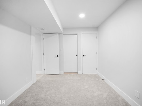 Finished basement with light carpet and recessed lighting - 9409 173 Street, Edmonton, AB - Indoor Photo Showing Other Room