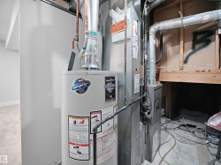 Utilities featuring water heater and heating unit - 