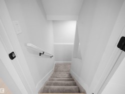 Staircase featuring baseboards and carpet floors - 