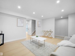 Living room featuring light wood finished floors and recessed lighting - 