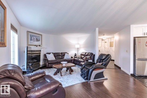 516 3 Perron Street, St. Albert, AB - Indoor Photo Showing Living Room With Fireplace