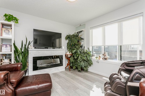 19627 28 Avenue, Edmonton, AB - Indoor Photo Showing Living Room With Fireplace