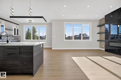 181 Edgewater Circle, Leduc, AB - Indoor Photo Showing Other Room With Fireplace