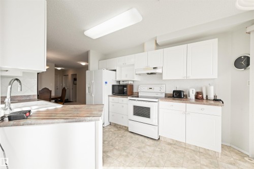 406 182 Haddow Close, Edmonton, AB - Indoor Photo Showing Kitchen With Double Sink