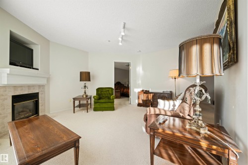 406 182 Haddow Close, Edmonton, AB - Indoor Photo Showing Living Room With Fireplace