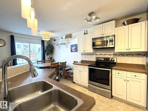 735 Kananaskis Drive, Devon, AB - Indoor Photo Showing Kitchen With Double Sink