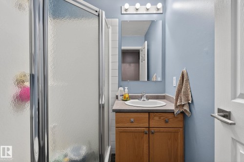 Full bathroom with vanity and a shower stall - 103 8108 109 Street, Edmonton, AB - Indoor Photo Showing Bathroom