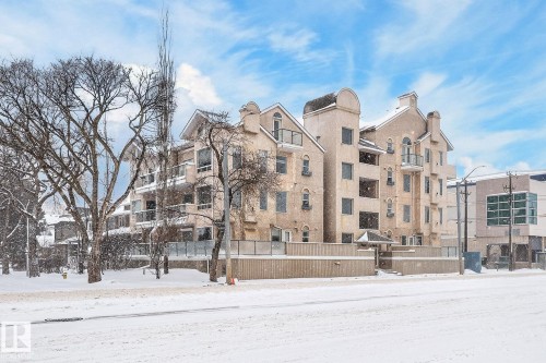 Snow covered property featuring a view of apartment building / complex - 103 8108 109 Street, Edmonton, AB - Outdoor With Facade