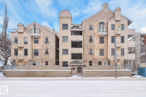 Snow covered property with a view of apartment building / complex - 103 8108 109 Street, Edmonton, AB - Outdoor With Facade