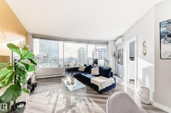 Living room with wood finish floors and baseboard heating - 