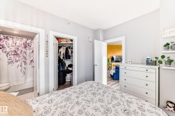 Bedroom featuring a walk in closet - 