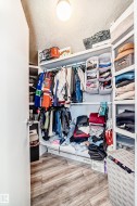 Walk in closet with light wood-type flooring - 