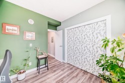 Home office with wood finished floors and baseboards - 